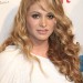 Paulina Rubio de blanco con un look fashion